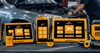 GEARWRENCH SMART Diagnostics family set up on top of a GEARWRENCH rolling cabinet with a working auto shop in the background