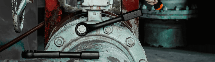 GEARWRENCH slugging wrench being used to tighten a bolt in an industrial setting