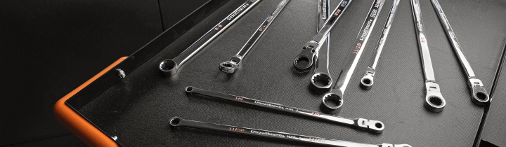 GEARWRENCH 120XP Ratcheting Wrenches sitting on top of a work table