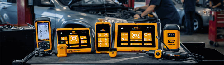 GEARWRENCH SMART Diagnostics family set up on top of a GEARWRENCH rolling cabinet with a working auto shop in the background