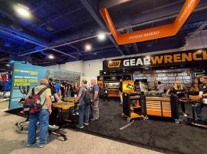 Attendees visit the GEARWRENCH booth at SEMA, exploring tool displays and speaking with product experts in a hands-on trade show environment.