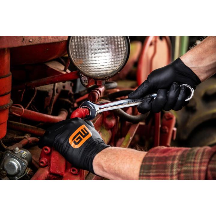 Image of the GW 85599 showing one of the wrenches being used by a person on a car engine