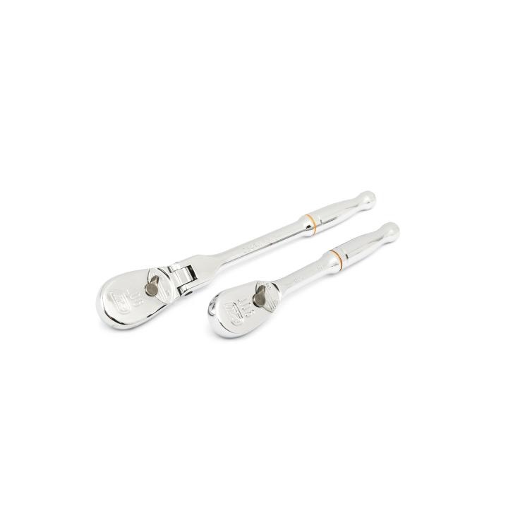 Two chrome 90-tooth ratchets, one long and one compact, lie diagonally side by side on a white background; each has an orange accent band near the handle.