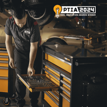 Mechanic getting tools from his MEGAMOD foam tray in tool chest with PTIA winner logo