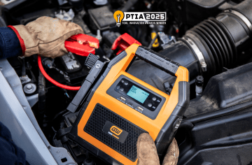 GEARWRENCH GWLBJ30 being used to jump start a car battery with the PTIA 2025 Award Winner logo in the upper right corner