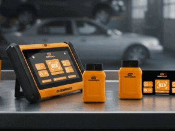 GEARWRENCH SMART Diagnostics line up on top of a stainless steel rolling tool cabinet within an auto shop