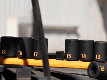 GEARWRENCH hi-viz impact socket set sitting on top of a tool cart