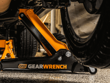 GEARWRENCH floor jack and jack standing lifting and holding a car up