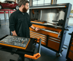 Male mechanic opening his GEARWRENCH MEGAMOD1331 cabinet drawer for additional tools